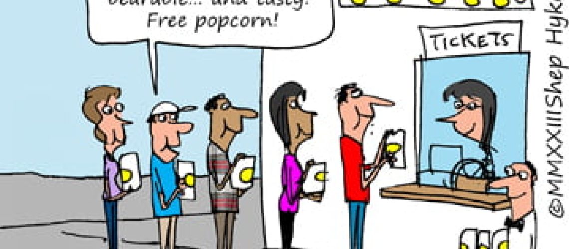 customers standing in line at a movie eating free popcorn